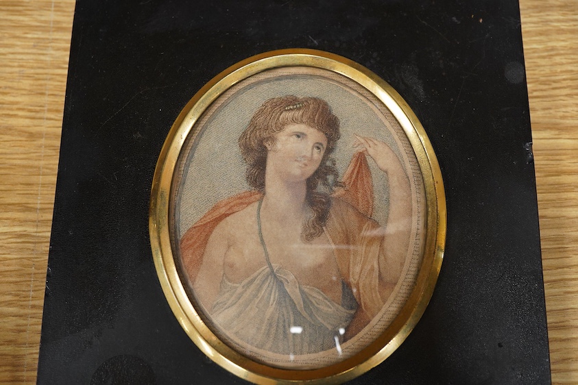 Two early 19th century cut-paper silhouette portraits of ladies, together with a stipple engraving, Portrait of a semi-nude woman, largest 10 x 8.5cm, each housed in ebonised frames